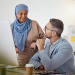 Training, question and computer with business people in office for creative, diversity and coaching